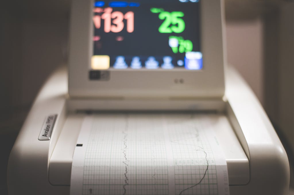 Detailed image of an electronic fetal monitoring machine showing heart rate and contraction data.